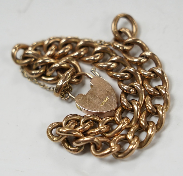 An early 20th century 9ct curb link bracelet, with heart shaped padlock clasp, 18cm, 13.6 grams. Condition - fair